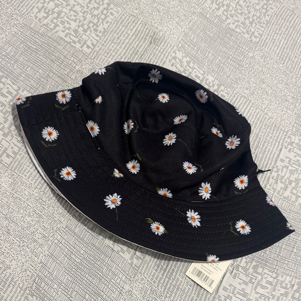Alice + Olivia Black Daisy Bucket Hat and it’s reversible.